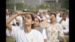 People doing breathing exercises as part of a yoga performance on International Day of Yoga on Tuesday, June 21, 2022. (Sakib Ali /Hindustan Times) People doing breathing exercises as part of a yoga performance on International Day of Yoga on Tuesday, June 21, 2022. (Sakib Ali /Hindustan Times)