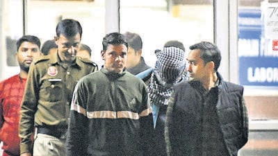 Police escort Aaftab Poonawala (masked) out of Delhi’s Forensic Science Laboratory after he took a polygraph test on Thursday. (ANI)