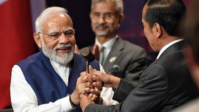 President of Indonesia Joko Widodo symbolically handed over the G20 Presidency to Prime Minister Narendra Modi at the G20 summit, in Bali on Wednesday. (PIB) President of Indonesia Joko Widodo symbolically handed over the G20 Presidency to Prime Minister Narendra Modi at the G20 summit, in Bali on Wednesday. (PIB)