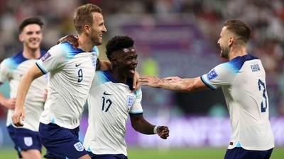 Bukayo Saka celebrates scoring their fourth goal with Harry Kane and Luke Shaw (REUTERS)