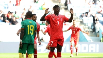 Embolo puts up his hands apologetically after scoring Switzerland's first goal (REUTERS)
