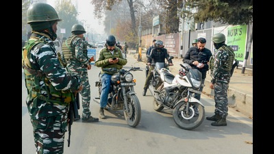 Security personnel frisk bike riders during high-alert following the recent killings of non-locals and threat to journalists and reporters based in Kashmir, in Srinagar. (PTI) Security personnel frisk bike riders during high-alert following the recent killings of non-locals and threat to journalists and reporters based in Kashmir, in Srinagar. (PTI)