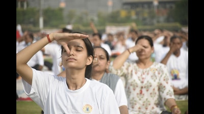 People doing breathing exercises as part of a yoga performance on International Day of Yoga on Tuesday, June 21, 2022. (Sakib Ali /Hindustan Times) People doing breathing exercises as part of a yoga performance on International Day of Yoga on Tuesday, June 21, 2022. (Sakib Ali /Hindustan Times)