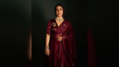 Kajol's outfit comes with a maroon satin silk blouse, a lehenga and a sheer matching dupatta. (Instagram/@kajol) Kajol's outfit comes with a maroon satin silk blouse, a lehenga and a sheer matching dupatta. (Instagram/@kajol)