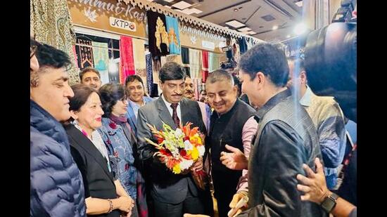 J&K chief secretary AK Mehta being welcomed at the ‘Jammu Sapphire’ stall. (HT Photo)