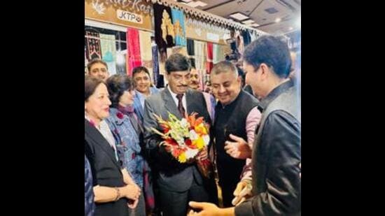 J&K chief secretary AK Mehta being welcomed at the ‘Jammu Sapphire’ stall. (HT Photo)