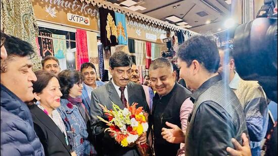 J&K chief secretary AK Mehta being welcomed at the ‘Jammu Sapphire’ stall. (HT Photo)