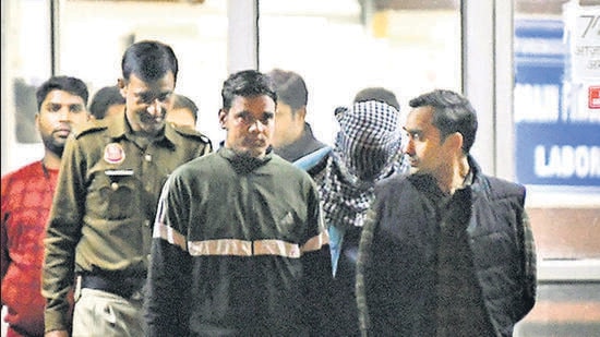 Police escort Aaftab Poonawala (masked) out of Delhi’s Forensic Science Laboratory after he took a polygraph test on Thursday. (ANI)