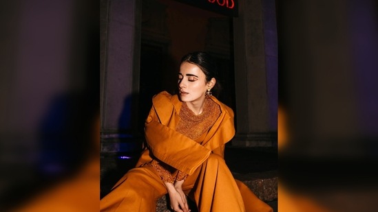 Radhika Madan wore a bustier top which she paired with wide trousers and an overcoat with ruffle sleeves.(Instagram/@radhikamadan)