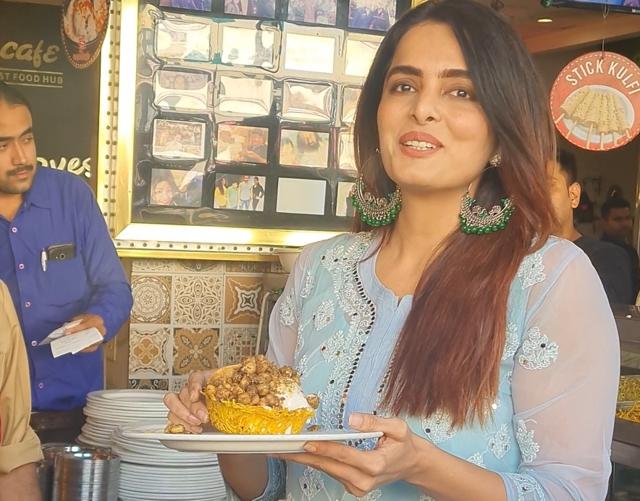 Ruhi relishing basket chaat in Lucknow. Ruhi relishing basket chaat in Lucknow.