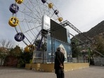 Afghanistan: An Afghan man stands in an amusement park in Kabul, Afghanistan.