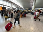 UK Airports: Travelers at an airport in London. UK Airports: Travelers at an airport in London.