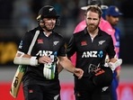 New Zealand's Tom Latham, left, and Kane Williamson walk off after their win over India in their one day international cricket match in Auckland, New Zealand, Friday, Nov. 25, 2022.
