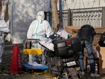 Covid In Beijing: Workers in protective clothing control access into a community under lockdown in Beijing.
