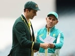 Former Australia head coach Justin Langer(right) with Pat Cummins