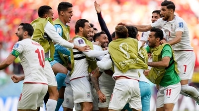 Iran's Rouzbeh Cheshmi, not seen, celebrates scoring the opening goal with teammates during the World Cup group B soccer match between Wales and Iran, at the Ahmad Bin Ali Stadium in Al Rayyan , Qatar, Friday, Nov. 25, 2022. (AP)