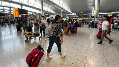 UK Airports: Travelers at an airport in London. (AP) UK Airports: Travelers at an airport in London. (AP)