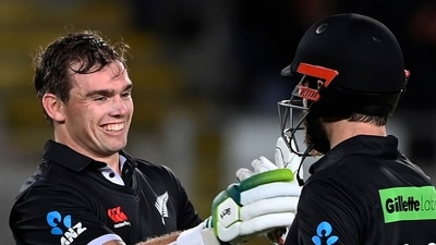 New Zealand's Tom Latham, left, celebrates his century with batting partner Kane Williamson while playing India in their one day international cricket match in Auckland, New Zealand, Friday, Nov. 25, 2022. (AP) New Zealand's Tom Latham, left, celebrates his century with batting partner Kane Williamson while playing India in their one day international cricket match in Auckland, New Zealand, Friday, Nov. 25, 2022. (AP)