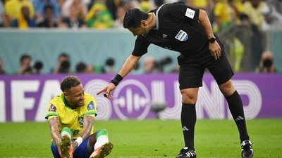 Iranian referee Alireza Faghani gestures to Neymar during the FIFA World Cup 2022 Group G match between Brazil and Serbia (AFP) Iranian referee Alireza Faghani gestures to Neymar during the FIFA World Cup 2022 Group G match between Brazil and Serbia (AFP)