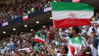 Iran's fans celebrate at the Qatar 2022 World Cup Group B football match between Wales and Iran at the Ahmad Bin Ali Stadium. (AFP) Iran's fans celebrate at the Qatar 2022 World Cup Group B football match between Wales and Iran at the Ahmad Bin Ali Stadium. (AFP)
