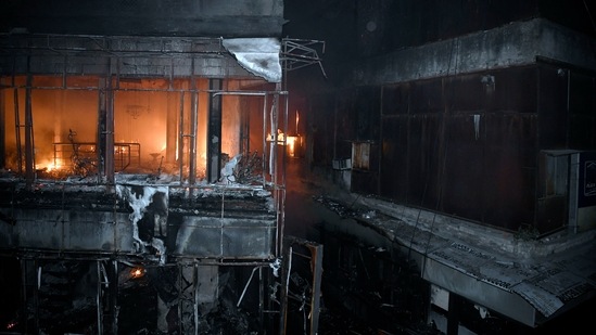 Currently, 22 fire tenders are engaged in the cooling process as the fire has been brought under control after over 12 hours, a fire department official said.(ANI)