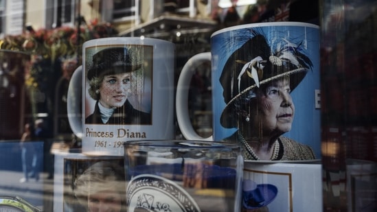 Queen Elizabeth II- Princess Diana: Mugs with photos of late Queen Elizabeth II and Princess Diana, are seen.(AP)
