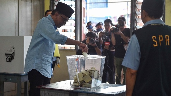 Malaysia Election: Malaysia's opposition leader Anwar Ibrahim, chairman of the Pakatan Harapan (Alliance of Hope), casts his ballot at a polling station during the general election in Permatang Pauh.(AFP)