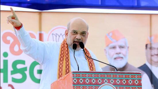 Union home minister Amit Shah addresses a public meeting for the upcoming Gujarat assembly elections in Vagra on Friday. (Amit Shah/Twitter)