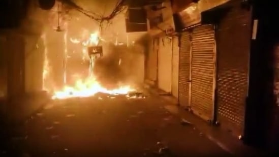 Flames and smoke billow out as fire broke out in the shops of Bhagirath Palace market of Chandni Chowk, in old Delhi on Thursday.(ANI)