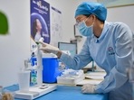 The country had recorded 32,943 new cases a day earlier – 3,103 symptomatic and 29,840 asymptomatic infections.(AFP) The country had recorded 32,943 new cases a day earlier – 3,103 symptomatic and 29,840 asymptomatic infections.(AFP)