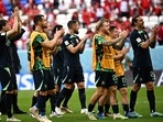Australia's players  celebrate after winning the Qatar 2022 World Cup Group D football match between Tunisia and Australia at the Al-Janoub Stadium in Al-Wakrah