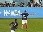 Kylian Mbappe celebrates after scoring his sides second goal during the FIFA World Cup group D match between France and Denmark, at the Stadium 974 in Doha.