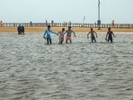 Chennai: Youngsters play at the flooded Marina Beach following incessant rains, in Chennai.(PTI file) Chennai: Youngsters play at the flooded Marina Beach following incessant rains, in Chennai.(PTI file)