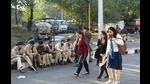 Commuters passing through Sector 51, Chandigarh, on foot due to the bottleneck caused by the farmers’ march. (Ravi Kumar/HT) Commuters passing through Sector 51, Chandigarh, on foot due to the bottleneck caused by the farmers’ march. (Ravi Kumar/HT)