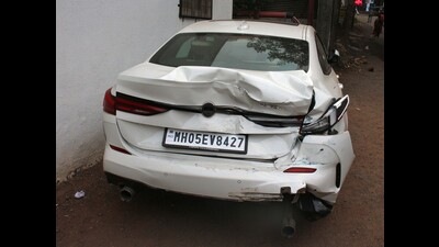 One of the vehicles hit by the speeding tanker at Navale bridge on Saturday. (Ravindra Joshi/ HT PHOTO)