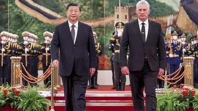 Chinese President Xi Jinping and Cuba's President Miguel Diaz-Canel Bermudez walk during a welcome ceremony. (AP) Chinese President Xi Jinping and Cuba's President Miguel Diaz-Canel Bermudez walk during a welcome ceremony. (AP)