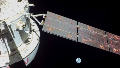 NASA's Orion spacecraft captured looking back at the Earth from a camera mounted on one of its solar arrays. NASA's Orion capsule is now circling the moon in an orbit stretching tens of thousands of miles. (AP/ NASA) NASA's Orion spacecraft captured looking back at the Earth from a camera mounted on one of its solar arrays. NASA's Orion capsule is now circling the moon in an orbit stretching tens of thousands of miles. (AP/ NASA)