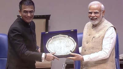 Prime Minister Narendra Modi being presented a memento by CJI DY Chandrachud during the Constitution Day celebrations in New Delhi on Saturday. (PTI) Prime Minister Narendra Modi being presented a memento by CJI DY Chandrachud during the Constitution Day celebrations in New Delhi on Saturday. (PTI)