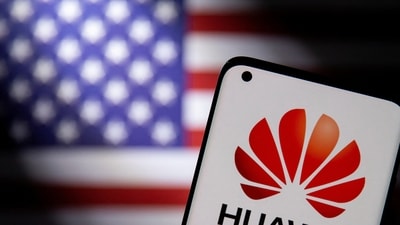 Smartphone with a Huawei logo is seen in front of a US flag in this illustration. (Reuters)