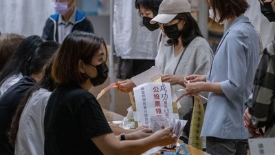 Taiwan Elections: Voters at a polling station during local elections in Taipei, Taiwan. (Bloomberg) Taiwan Elections: Voters at a polling station during local elections in Taipei, Taiwan. (Bloomberg)