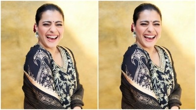 Kajol further teamed her salwar with a pair of black ethnic trousers with wide legs, decorated in golden zari details. In a black satin dupatta with golden zari borders, she completed her look. (Instagram/@kajol) Kajol further teamed her salwar with a pair of black ethnic trousers with wide legs, decorated in golden zari details. In a black satin dupatta with golden zari borders, she completed her look. (Instagram/@kajol)