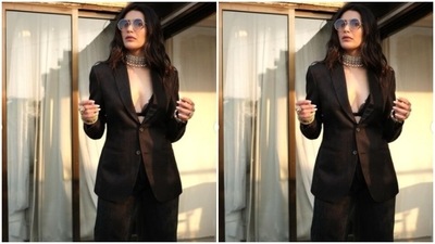 Karishma further accessorised her look for the day in tinted shades, a silver neck choker, and multiple golden bangles and bracelet from the shelves of All That Glitterss. (Instagram/@karishmaktanna) Karishma further accessorised her look for the day in tinted shades, a silver neck choker, and multiple golden bangles and bracelet from the shelves of All That Glitterss. (Instagram/@karishmaktanna)