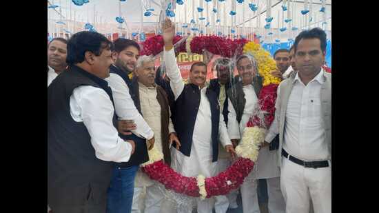 Shivpal Yadav with party supporters in Barnahal (Karhal) area of Mainpuri on Saturday. (HT photo)