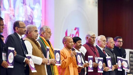 Uttar Pradesh chief minister Yogi Adityanath with his cabinet colleagues and officials at a curtain raiser event in connection with the road shows to be held in the run-up to the Uttar Pradesh Global Investors Summit-2023. (FILE PHOTO)