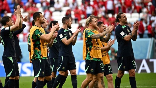 Australia's players celebrate after winning the Qatar 2022 World Cup Group D football match between Tunisia and Australia at the Al-Janoub Stadium in Al-Wakrah