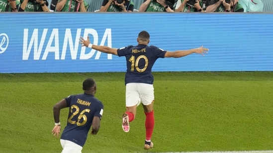 Kylian Mbappe celebrates after scoring his sides second goal during the FIFA World Cup group D match between France and Denmark, at the Stadium 974 in Doha.(AP)