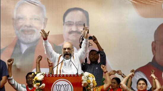 Union home minister Amit Shah speaks during a public meeting ahead of Gujarat assembly elections, in Ahmedabad, on Saturday. (PTI)