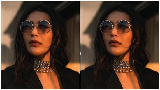 Karishma decked up in a black laced bralette and layered it with a black formal blazer with lapel collars and full sleeves. Karishma further added a pair of black formal trousers and completed her look.(Instagram/@karishmaktanna)