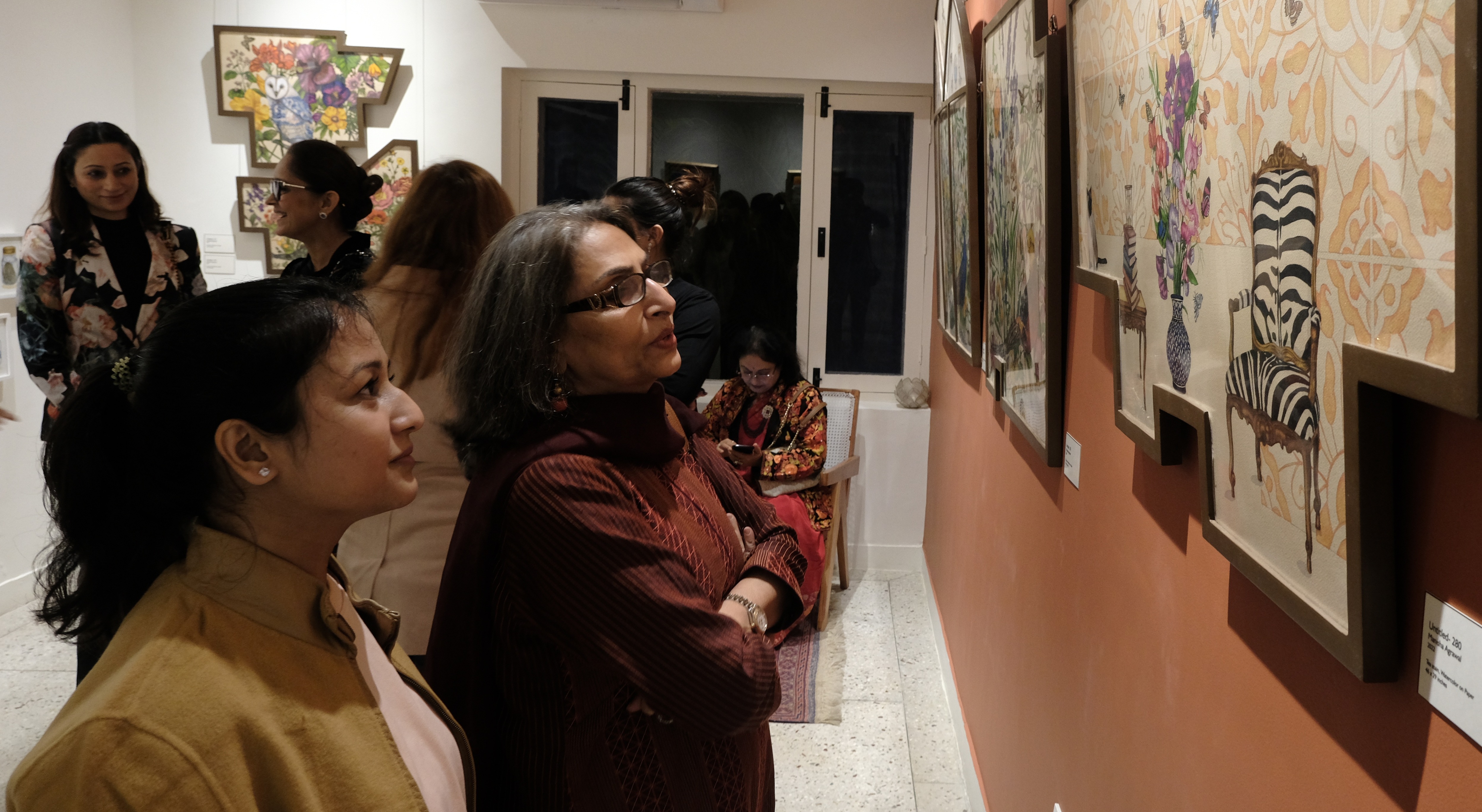 Tricity art lovers taking a look at the pieces on display Tricity art lovers taking a look at the pieces on display