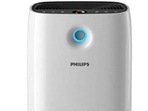 A white portable air purifier with a small plant on the side (Amazon) A white portable air purifier with a small plant on the side (Amazon)